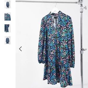 Maternity mini smock dress with peplum hem and tie neck detail in black and brig